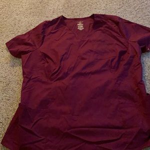 New without tags. Size 2X women’s burgundy scrub top. Jaanuu brand.